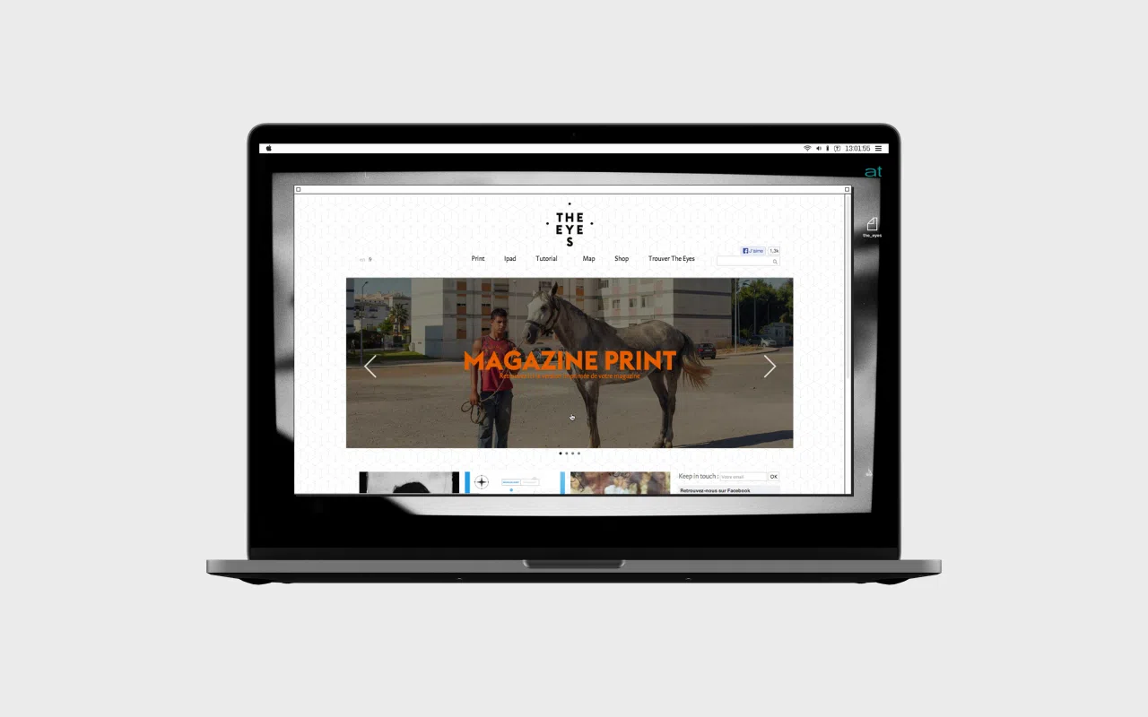 Écran d’ordinateur portable, affichant la page d’accueil du site web de la revue The Eyes.